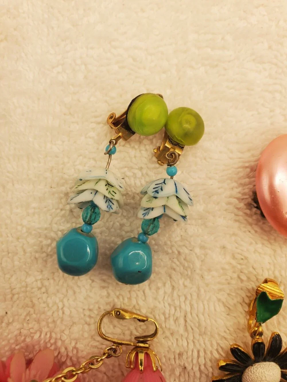 12 Pair of clip on earrings, items # B-2106-2117,.  wt. 123 grams.